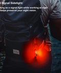 Person wearing a backpack with a Rechargeable USB C EDC Flashlight Keychain Mini Light 650 Lumens glowing red