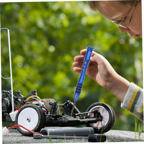 Child using RC Car Screw Fasteners Tool Kit With Wrench And Arm Pin Screws For Quick Repairs And Easy Maintenance on RC car outdoors.