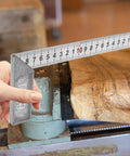 Pro Grade Right Angle Ruler Measuring Tool L Square 90 Degree Stainless Steel Gauge held over a wooden surface.