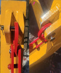 1-ton automatic decoupling lifting hook mounted on yellow forklift attachment; red linkage plates.  
1-ton auto-separating lifting hook close-up, red hook with bolt on yellow steel plate.