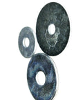 Top Shelf 1/4 X 1-1/2 Inch Stainless Steel Washers Hella Tough Corrosion Resistant Hardware Fasteners 1000 Pack, three washers placed at different angles.