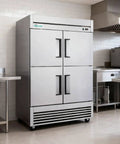 Top Shelf Heavy Duty Commercial Upright Freezer With Four Solid Doors And Slick Stainless Steel Construction 44.5 Cu Ft Reach In Rig For Restaurants Bars Or Garages Ice Cold Fan Cooling Setup in a kitchen setting.