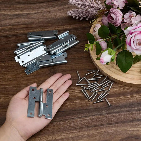 Hand holding Ten Pack 3x2 Iron H Shape Removable Lift Off Door Hinge with screws on wooden surface