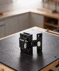 Boss Level Stainless Steel Hydraulic Glass Door Hinge offering no hassle U shape clip installation on a workbench.