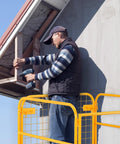 Forklift man basket, yellow steel safety cage with wheels for aerial work platform use.