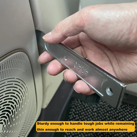 Hand holding 4140 Pry Tool Kit for Car Trim Removal quick pop out mighty miniature portable multitool next to car door panel.