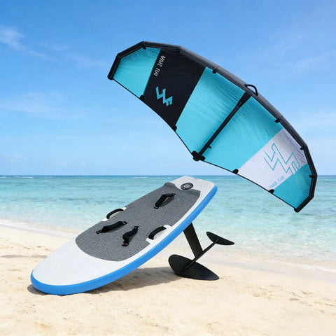 Go-To Wind Wingfoil And Hydrofoil Board Kit With Inflatable Wing Pack for portable foiling on the go on a sunny beach.