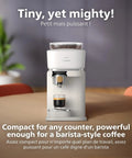 Compact Home Espresso Machine With Built In Grinder And 16 Bar Pump Auto Grinding Tamping And Brewing For Smooth Bean To Cup Coffee Without The Daily Grind Stress on a countertop with an espresso shot.