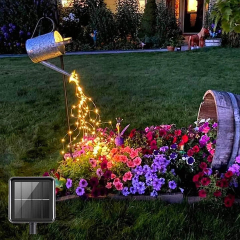 Solar Powered Fairy Lights Outdoor Waterproof 200 LEDs Copper Wire String Lights illuminating garden flowers at night