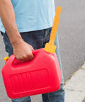 Person holding red gas can with Gas Can Spout Replacement Kit With 19 Pcs Nozzles For One Half, Five, Ten Gallon Cans.