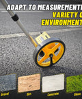 Zozen 6-Inch Measuring Wheel in Feet and Inches, Extended Telescopic Handle on asphalt measuring distance with adjustable features.