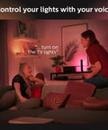 Two people using Smart Play Light Bar Base Kit For Immersive Gaming And TV Ambiance Dope White And Color Ambiance LED