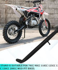 Stainless Steel Dirt Bike Stand With Spring, Motorcycle Side Kickstand For Dirt Pit Bikes by a dirt bike, shown installed