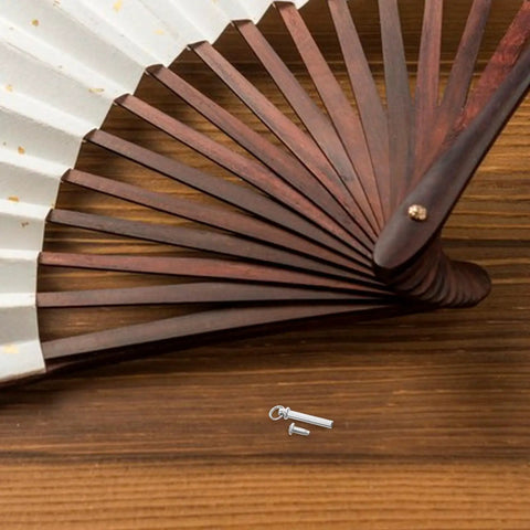 Premium Stainless Steel Fan Axle Rivet Kit Six Piece Set 17 To 22 mm Replacement Pins For Folding Hand Fans on wooden surface.