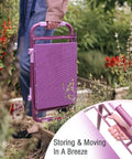 Person carrying Upgraded Garden Kneeler And Seat With Rugged Steel Frame Sturdy Kneeler Bench in a folded position