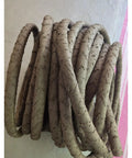Slick Artificial Tree Bark Cable Cover And Flexible Hollow Vine Conduit Tube for Hiding Exposed Wires in a coiled shape.