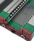 Close-up of MGN15C Linear Guide Block from rail set, showing ball bearings and stainless steel carriage, for CNC machines and 3D printers