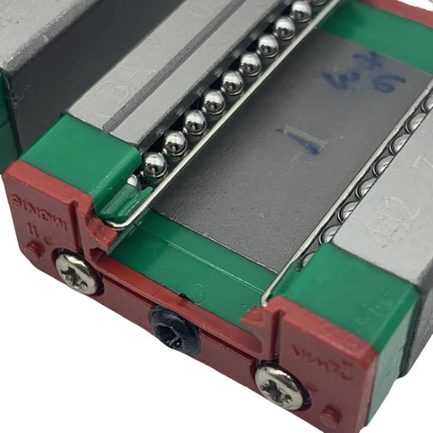 Close-up of MGN15C Linear Guide Block from rail set, showing ball bearings and stainless steel carriage, for CNC machines and 3D printers