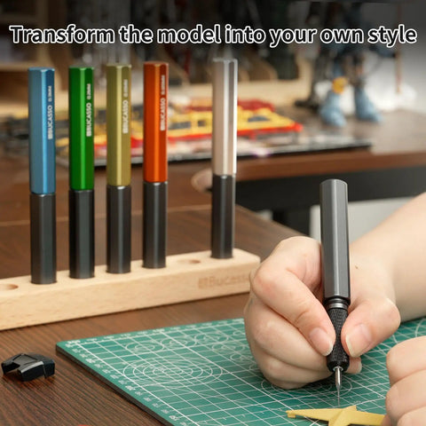 Person using Pro Grade 7 Piece Tungsten Steel Scribing Tool Set With Wooden Stand for model making, various blade sizes visible.