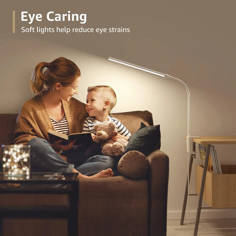 Space Saving Clip On Desk Lamp With Clamp USB Gooseneck Reading Light in living room with mother and child on couch, warm light setting.