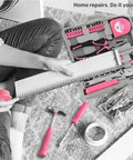 Person using a pink basic tool kit in a portable case for college dorm home and office DIY repairs with essential hand tools and tray