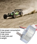 No Sweat Operation 12V DC Motor With Whisper Quiet Gearbox 5 RPM Reversible Drive For Vending And Automation Low Power Draw close-up with RC car on dirt track.