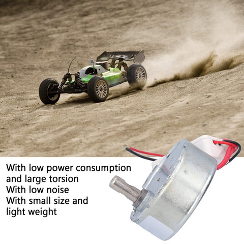 No Sweat Operation 12V DC Motor With Whisper Quiet Gearbox 5 RPM Reversible Drive For Vending And Automation Low Power Draw close-up with RC car on dirt track.