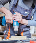 Person using a drill with 100 Piece Heavy Duty Zinc Steel Concrete Anchors, 3/8 Inch Threaded Rod, 1/4 Inch Diameter and 1-1/2 Inch Length.