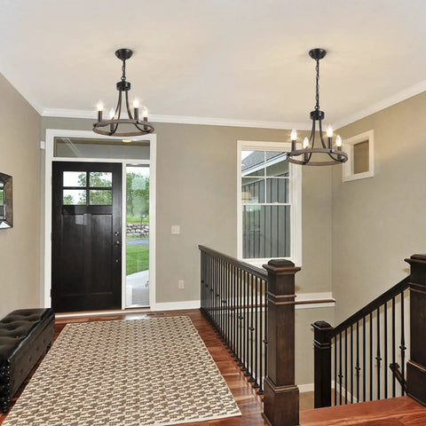Interior with Wagon Wheel Black Farmhouse Chandelier With 4 Lights in foyer, adding rustic charm and modern yet cozy glow.