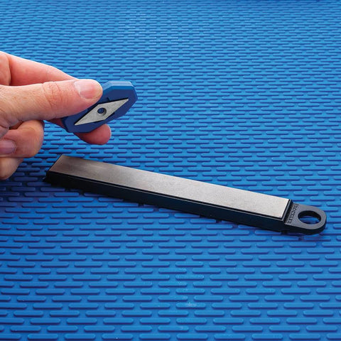 Carbide Cutter Honing System With Diamond Sharpening Tool And Magnetic Grip For Carbide Inserts on textured blue background