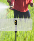 Person using Electric Sprayer Nozzle With Windproof Shield For High Pressure Atomizing Mist in agricultural field