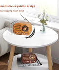 Retro Portable Bluetooth Speaker Radio With FM AM SW Bands on white table with adjustable antenna and wood finish design.