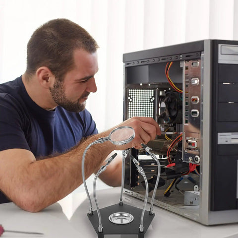Universal Soldering Station Helping Hands Kit With Adjustable Clamp And Flexible Arms For PCB Repair in use on computer