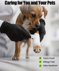 Black nitrile disposable gloves on hands wrapping a white bandage around a dog's paw
