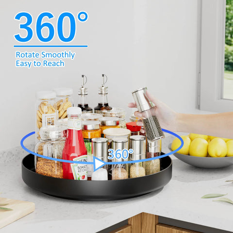 Ovicar 13-inch black metal Lazy Susan turntable with multiple spice jars on a kitchen counter.