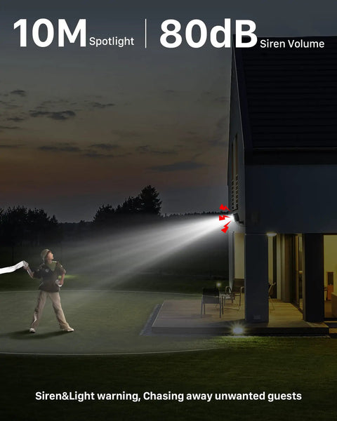 Solar Panel Powered WiFi Outdoor Security Camera Kit With 2K Resolution installed on house with spotlight and siren active
