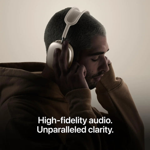 Person wearing AirPods Max 2 Wireless Over Ear Headphones With Active Noise Cancellation Adaptive Audio Personalized Spatial Audio Live Translation Bluetooth H2 Chip Boss Level Bass Crisp Mids And Highs Midnight