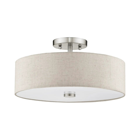 Meridian 3 Light Ceiling Mount Fixture in Brushed Nickel with Oatmeal Fabric Drum Shade, ideal for living room or dining area lighting.