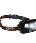 Rechargeable LED Headlamp With Adjustable Fabric Strap, 400 Lumens, All Day Runtime, Built For Work, Running, Outdoor Hiking, Camping, And Night Tasks, black headlamp with orange accents and silicone grip on strap, front view.