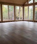 Top Shelf Aged Barrel Reactive Water Based Interior Wood Stain on newly finished wood flooring in bright, airy room.