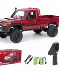Toyota 1/12 Scale RC Rock Crawler Pickup Truck With 2.4GHz 4WD Off Road Remote Control, red model with box, batteries, and remote