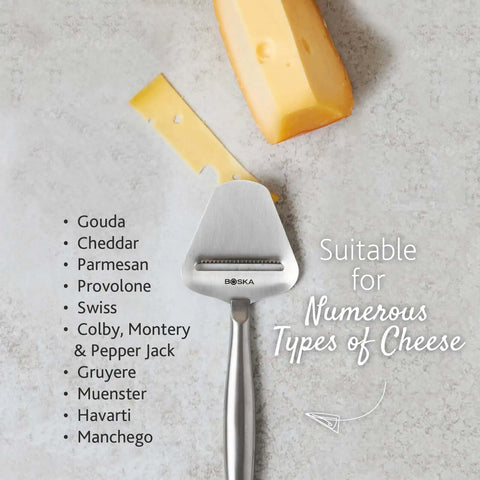 Stainless Steel Cheese Slicer Copenhagen Multifunctional Kitchen Tool shown with various cheeses on a marble surface