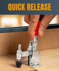 Heavy Duty 200 Lb Vertical Toggle Clamp With Quick Release in use, securing wood piece on a workbench, hand operating quick release