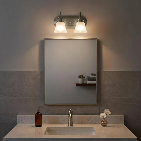 Bathroom with brushed nickel 2 light vanity bath light with satin etched glass shades above mirror.