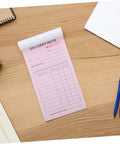 Carbon Copy Receipt Book For Small Biz 3 Part Invoice Pad With Simple Design And Clear Legibility Lightweight Order Receipt Book For Customer Transactions Fast Doc Speed And Error Reduction pink delivery note pad on desk