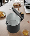 Tiny But Mighty 0.8L Electric Kettle With 1000W Fast Boil, Double Wall Stainless Steel, open lid view, black, on kitchen table