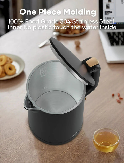 Tiny But Mighty 0.8L Electric Kettle With 1000W Fast Boil, Double Wall Stainless Steel, open lid view, black, on kitchen table