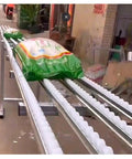 Smooth Industrial Warehouse Flow Rack Roller Conveyor With Abs Plastic Skids And Durable Steel Frame For Water Cases Beverage Shipping No Sweat Quick Setup transporting filled bags on roller tracks.