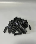 Pile of IC chips from Eight Piece IC Chip Kit For Electronics Projects Including Op Amp ICs And Timers With LM324 LM358 LM386 LM393 UA741 NE5532 NE555 PC817 Optical Isolator Ideal For Prototyping And DIY Electronics