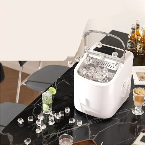 Top Shelf Quick Chill Portable Countertop Ice Maker with ice cubes on a marble table, perfect for parties and easy to clean.
